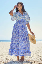 Model Tahneei wearing size 14 of the Pacific Beach Long Dress – Blue in colour Blue, from the front
