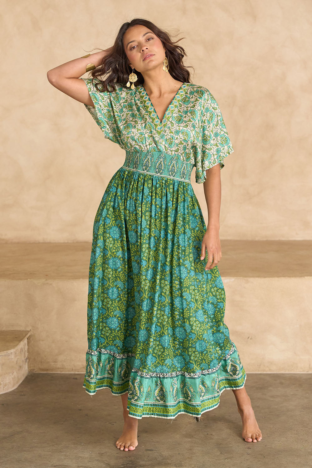 Model Tahnee wearing size 10 of the Pacific Beach Long Dress in colour Whitegreen (Green), from the front, showing the whole outfit