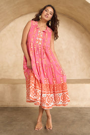 Model Tahnee wearing size 10 of the Jim Jim Falls Cotton Dress in colour Pinkorange (Pink), from the front, showing the whole outfit