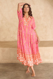 Model Tahnee wearing size 10 of the Jim Jim Falls Cotton Long Dress in colour Pinkorange (Pink), from the front, showing the whole outfit