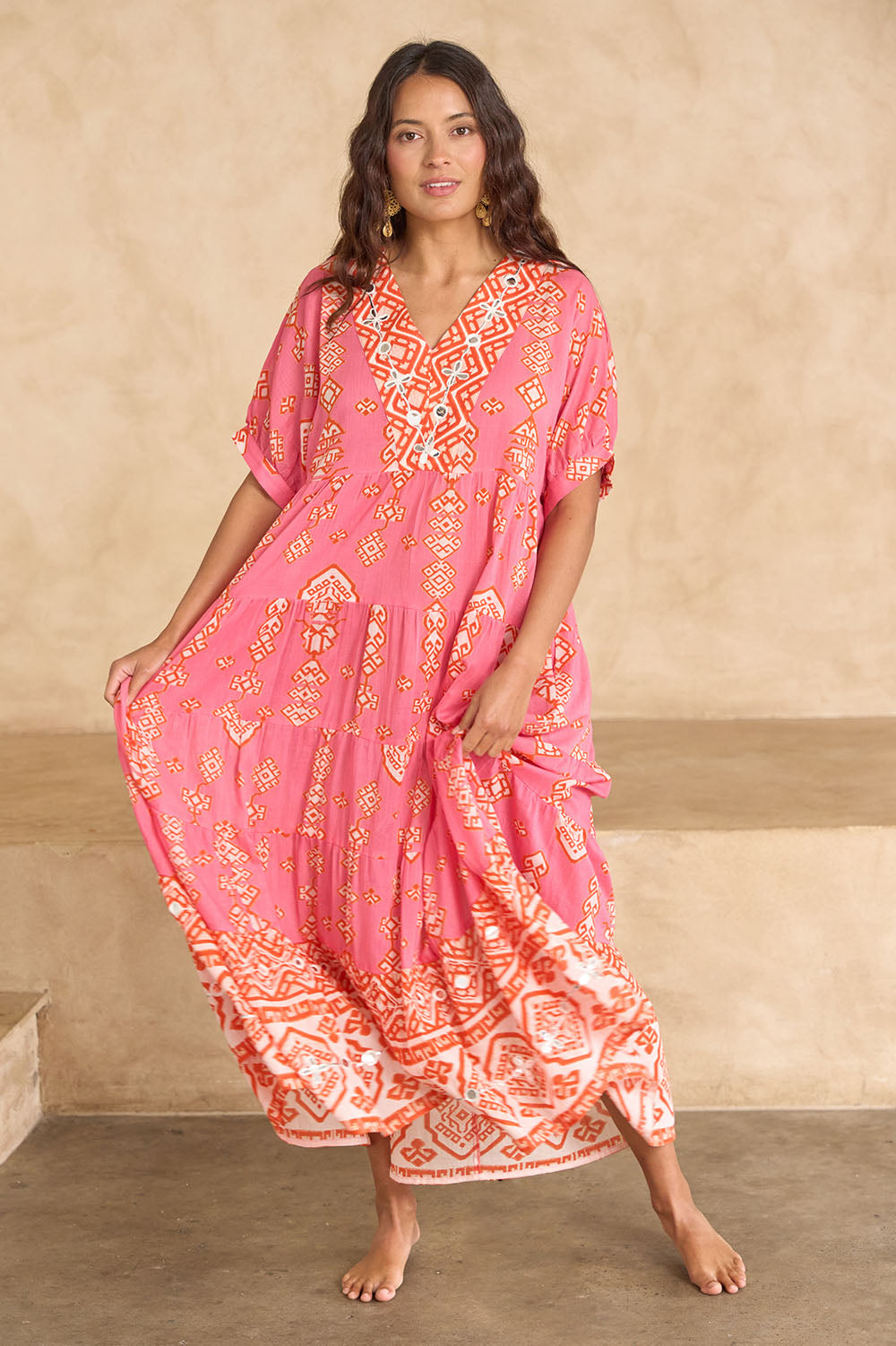 Model Tahnee wearing size 10 of the Jim Jim Falls Cotton Long Dress in colour Pinkorange (Pink), from the front, showing the whole outfit