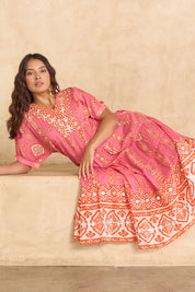 Model Tahnee wearing size 10 of the Jim Jim Falls Cotton Long Dress in colour Pinkorange (Pink), from the front, showing the whole outfit