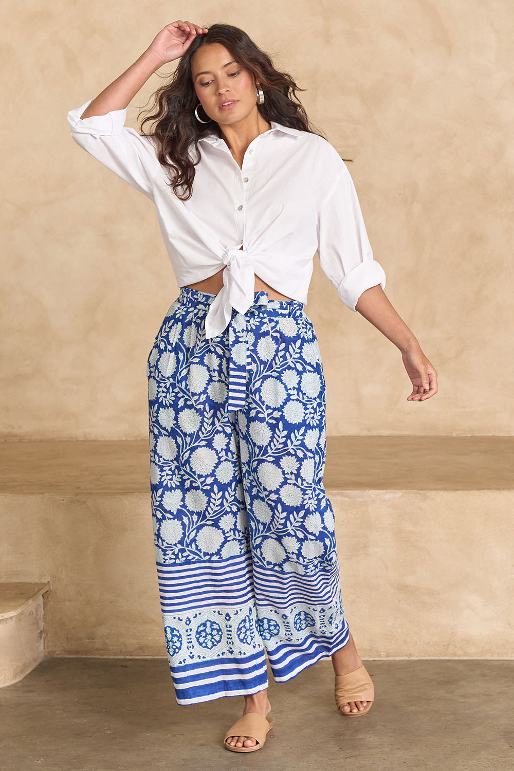 Model Tahnee wearing size 10 of the Kurrawa Beach Cotton Pant in colour Bluegreen (Blue), from the front, showing the whole outfit