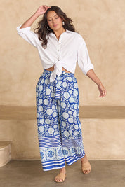 Model Tahnee wearing size 10 of the Kurrawa Beach Cotton Pant in colour Bluegreen (Blue), from the front, showing the whole outfit