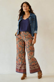 Model Tahnee wearing size 10 of the Adelong Falls Corduroy Pant in colour Ornate, from the front, showing the whole outfit