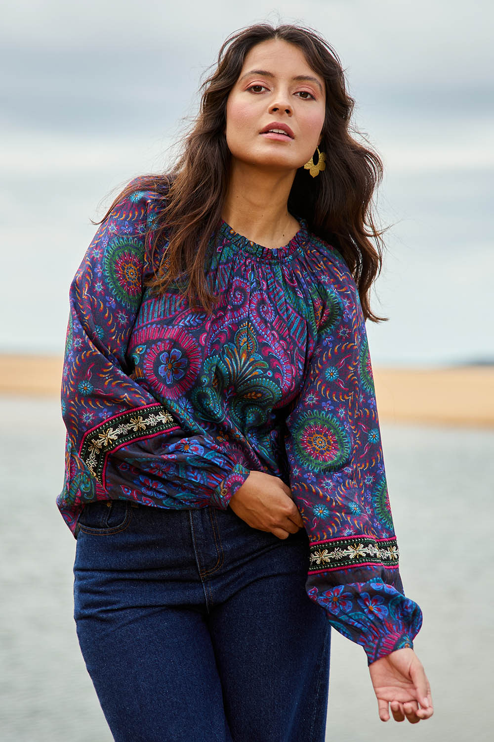 Model Tahnee wearing size 10 of the Finke Gorge Blouse in colour Paisley, from the front, showing the whole outfit