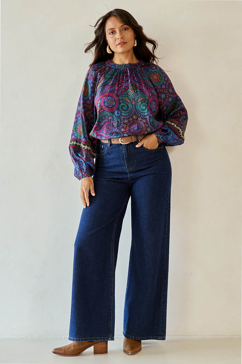 Model Tahnee wearing size 10 of the Finke Gorge Blouse in colour Paisley, from the front, showing the whole outfit