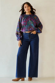 Model Tahnee wearing size 10 of the Finke Gorge Blouse in colour Paisley, from the front, showing the whole outfit