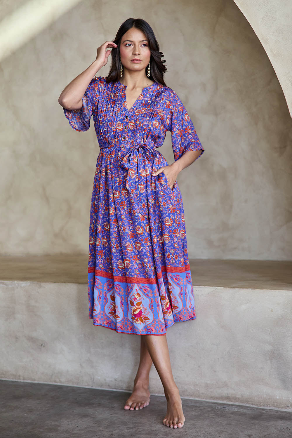 Model Tahneei wearing size 10 of the Turquoise Bay Dress – Rose in colour Rose, from the front