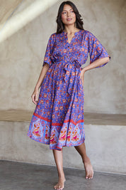 Model Tahneei wearing size 10 of the Turquoise Bay Dress – Rose in colour Rose, from the front