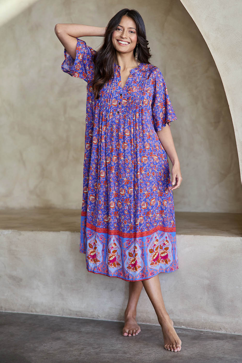 Model Tahneei wearing size 10 of the Turquoise Bay Dress – Rose in colour Rose, from the front
