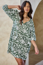 Model Tahneei wearing size 10 of the East Woody Point Cotton Dress – Green in colour Green, from an angle