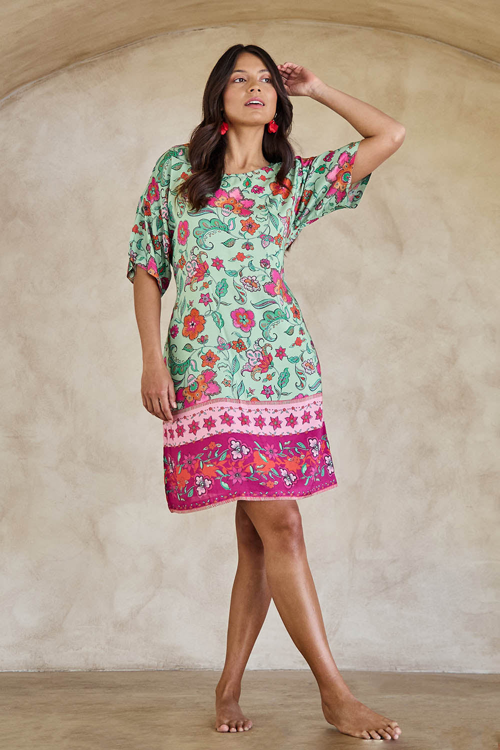 Model Tahneei wearing size 10 of the Queen's Beach Waist Tie Shift Dress – Floral in colour Floral, from the front