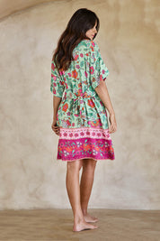 Model Tahneei wearing size 10 of the Queen's Beach Waist Tie Shift Dress – Floral in colour Floral, from the front