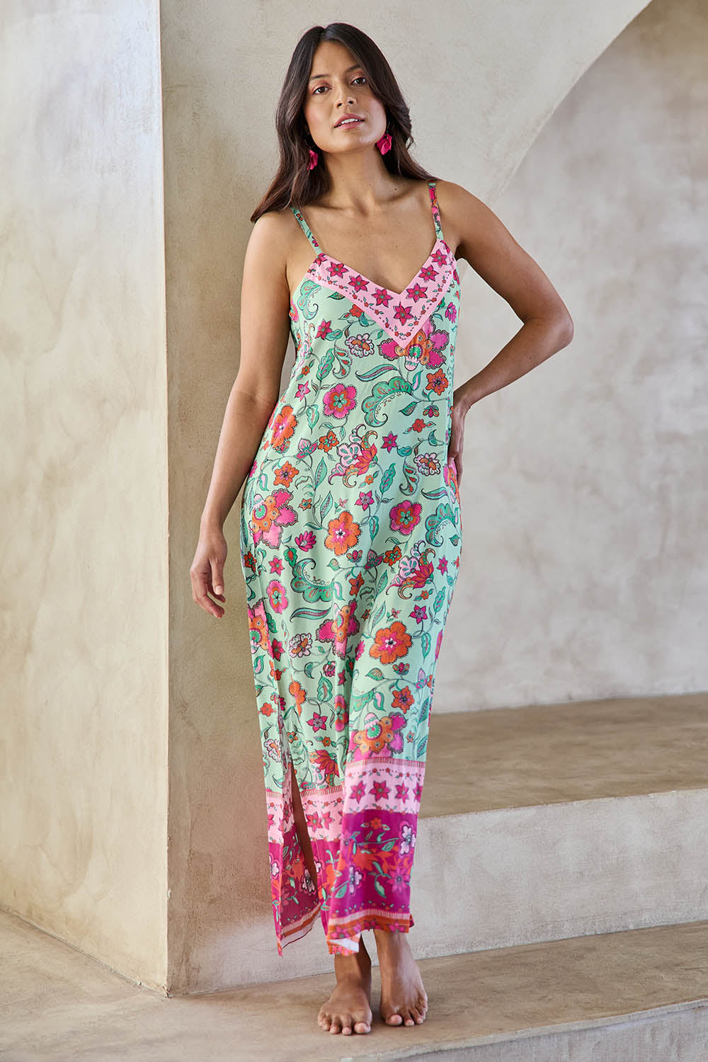 Model Tahneei wearing size 10 of the Queen's Beach Long Dress – Floral in colour Floral, from the front