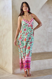 Model Tahneei wearing size 10 of the Queen's Beach Long Dress – Floral in colour Floral, from the front