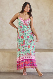 Model Tahneei wearing size 10 of the Queen's Beach Long Dress – Floral in colour Floral, from the front