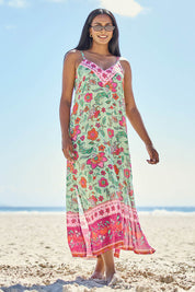 Model Tahneei wearing size 14 of the Queen's Beach Long Dress – Floral in colour Floral, from the front