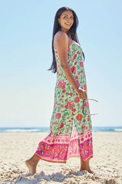 Model Tahneei wearing size 14 of the Queen's Beach Long Dress – Floral in colour Floral, from the front