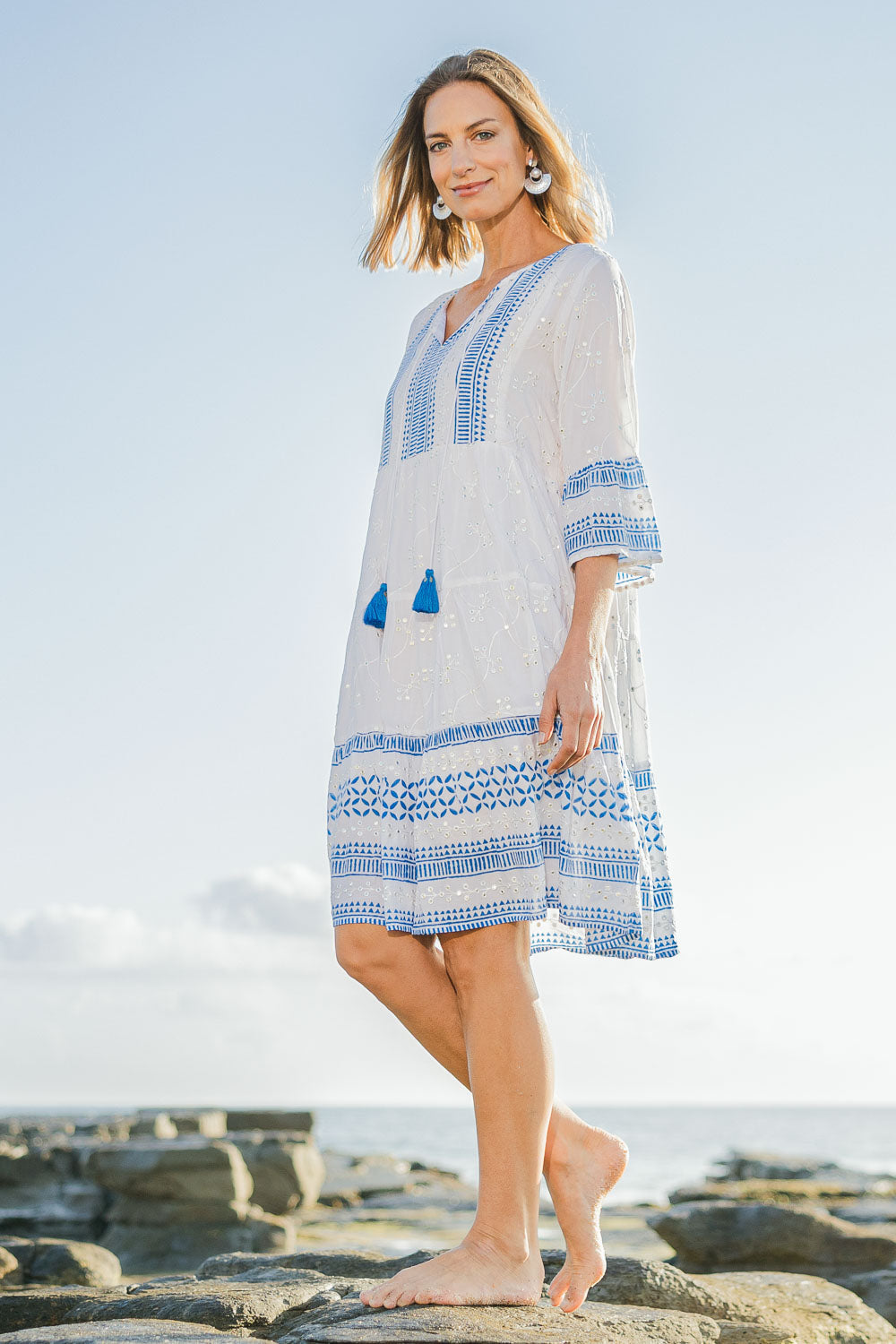 Model Riina wearing size 10 of the Bondi Beach Dress in colour Blue (Blue), from the front, showing the whole outfit