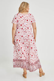 Model Keeara wearing size 16 of the Coogee Beach Cotton Maxi Dress in colour Red (Red), from the back