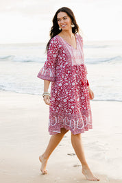 Model Stacey wearing size 10 of the Tallows Beach Cotton Dress in colour Red (Red), from the front, showing the whole outfit
