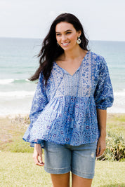 Model Stacey wearing size 10 of the Rosebud Beach Cotton Blouse in colour Blue (Blue), from the front, showing the whole outfit