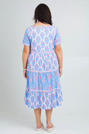 Model Poppy wearing size 16 of the Bilgola Beach Cotton Dress in colour Bluepink (Blue), from the back