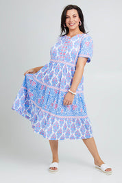 Model Poppy wearing size 16 of the Bilgola Beach Cotton Dress in colour Bluepink (Blue), from the front, showing the whole outfit