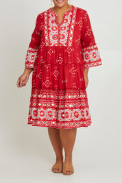 Model Ashleigh wearing size 16 of the Dee Why Beach Cotton Dress in colour Boldred (Red), from the front, cropped image