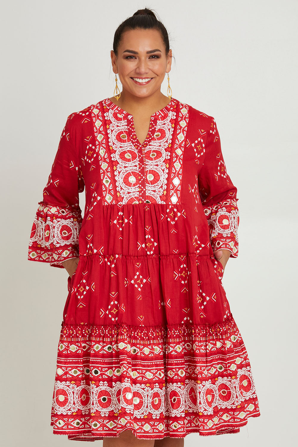 Model Ashleigh wearing size 16 of the Dee Why Beach Cotton Dress in colour Boldred (Red), from the front, cropped image