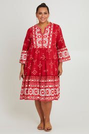 Model Ashleigh wearing size 16 of the Dee Why Beach Cotton Dress in colour Boldred (Red), from the front, showing the whole outfit