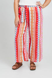 Model Poppy wearing size 16 of the Moon Bay Cotton Pants in colour Multipink (Pink), from the front, cropped image