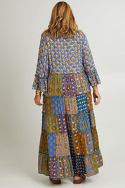 Model Fiona wearing size 16 of the Brighton Beach Maxi Dress in colour Patchblue (Blue), from the back