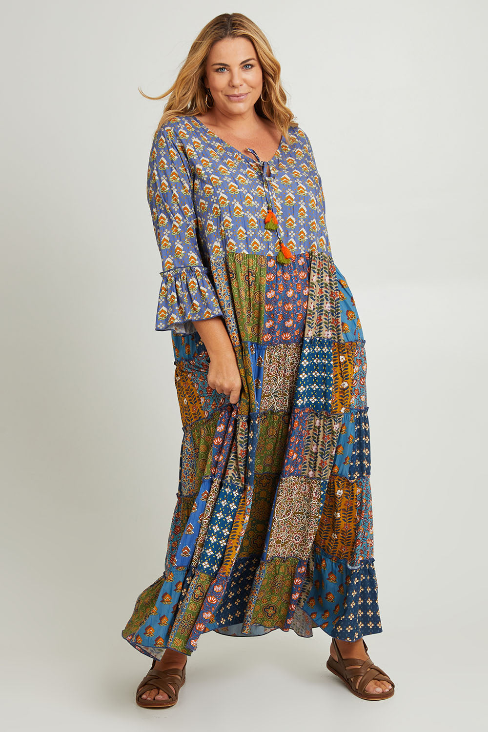 Model Fiona wearing size 16 of the Brighton Beach Maxi Dress in colour Patchblue (Blue), from the front, showing the whole outfit