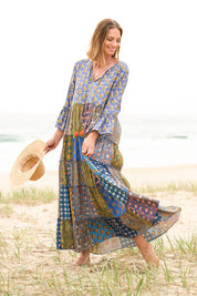 Model Riina wearing size 10 of the Brighton Beach Maxi Dress in colour Patchblue (Blue), from the front, showing the whole outfit