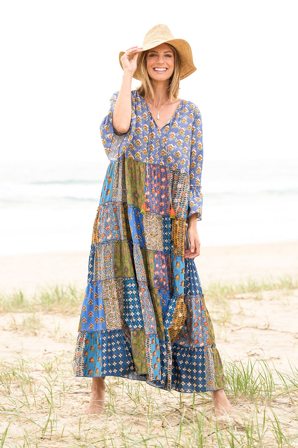 Model Riina wearing size 10 of the Brighton Beach Maxi Dress in colour Patchblue (Blue), from the front, showing the whole outfit