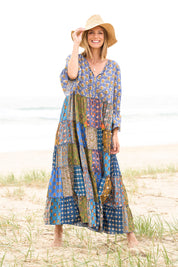 Model Riina wearing size 10 of the Brighton Beach Maxi Dress in colour Patchblue (Blue), from the front, showing the whole outfit