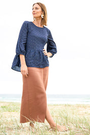 Model Riina wearing size 10 of the Belle Beach Top in colour Navy (Blue), from the front, showing the whole outfit
