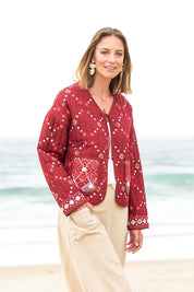 Model Riina wearing size 10 of the Balmoral Beach Jacket in colour Rust (Red), from the front, showing the whole outfit
