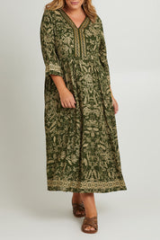 Model Fiona wearing size 16 of the Greenly Beach Dress in colour Green (Green), from the front, cropped image