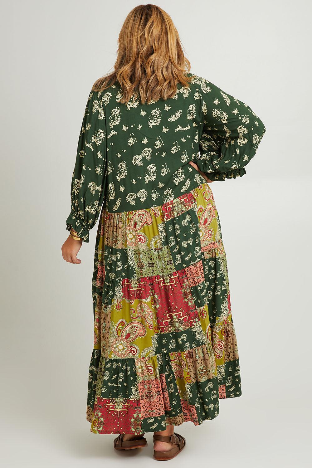 Model Fiona wearing size 16 of the Middleton Beach Maxi Dress in colour Patcholive (Green), from the back