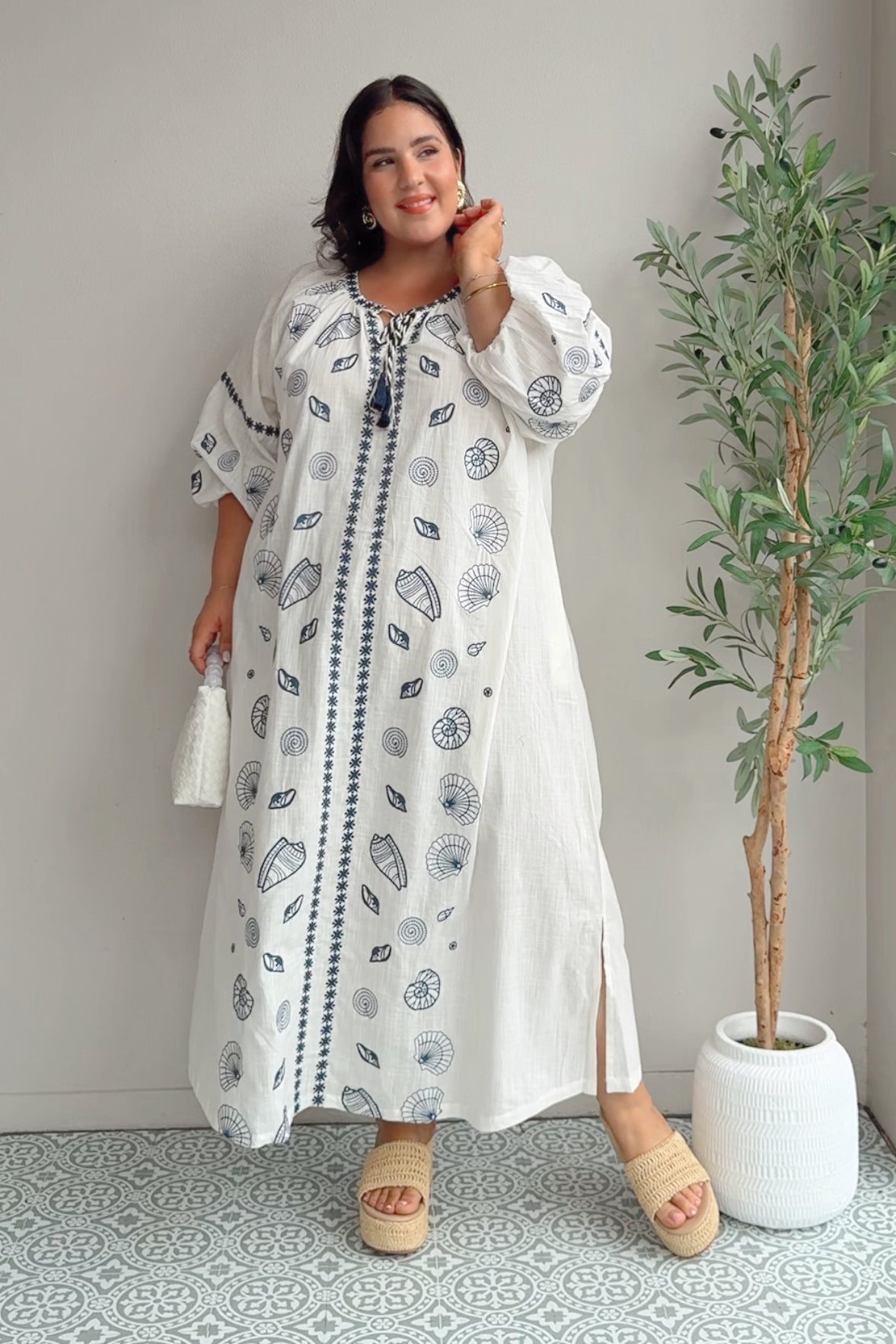 Model Maddy wearing size 22 of the Whitehaven Beach Cotton Maxi Dress in colour Whiteblue (Blue), from the front, showing the whole outfit