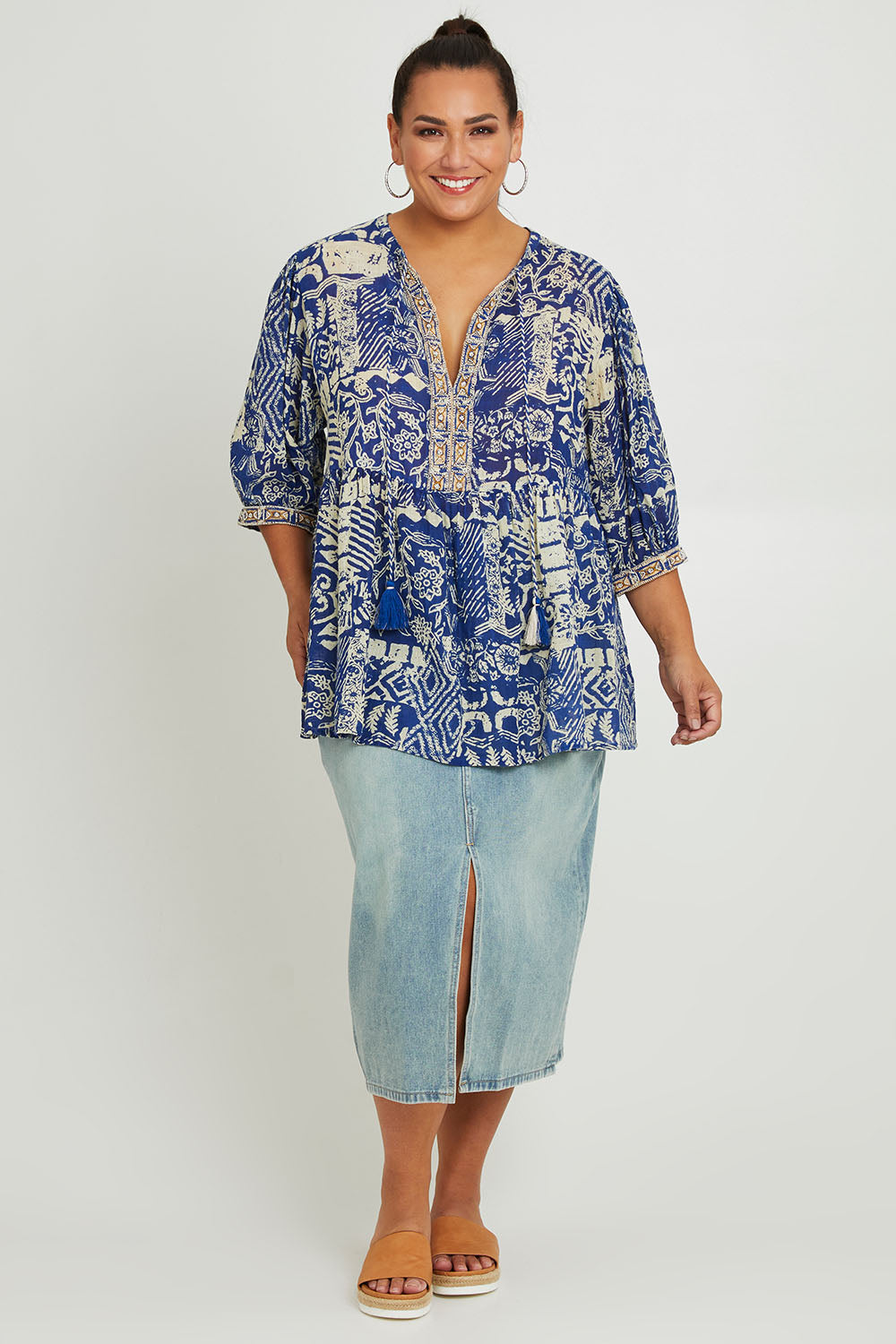 Model Ashleigh wearing size 16 of the Tathra Beach Cotton Top in colour Blue (Blue), from the front, showing the whole outfit