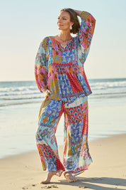Model Riina wearing size 10 of the Burleigh Beach Top in colour Patchmulti, from the front, showing the whole outfit