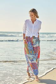Model Riina wearing size 10 of the Burleigh Beach Pant in colour Patchmulti, from the front, showing the whole outfit