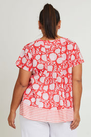 Model Ashleigh wearing size 16 of the Kurrawa Beach Cotton Top in colour Redcoral (Red), from the back