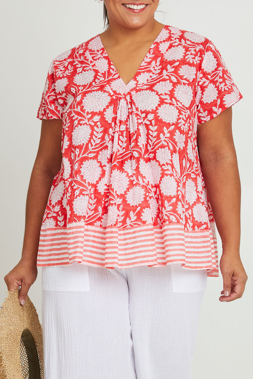 Model Ashleigh wearing size 16 of the Kurrawa Beach Cotton Top in colour Redcoral (Red), from the front, cropped image