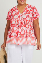 Model Ashleigh wearing size 16 of the Kurrawa Beach Cotton Top in colour Redcoral (Red), from the front, cropped image