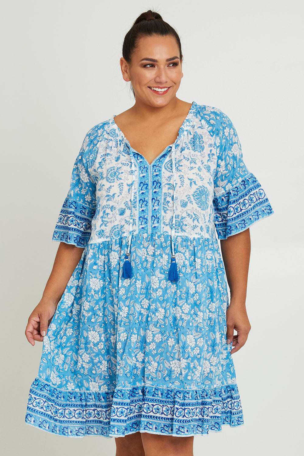 Model Ashleigh wearing size 14 of the Cottesloe Beach Cotton Dress in colour Bluefloral (Blue), from the front, cropped image